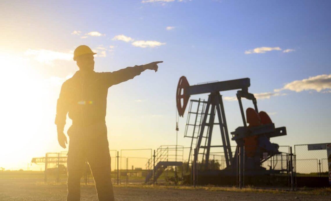 Oil industry worker works in oilfield