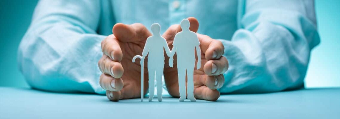 Hand Protecting Senior Couple