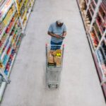 man shops at grocery store