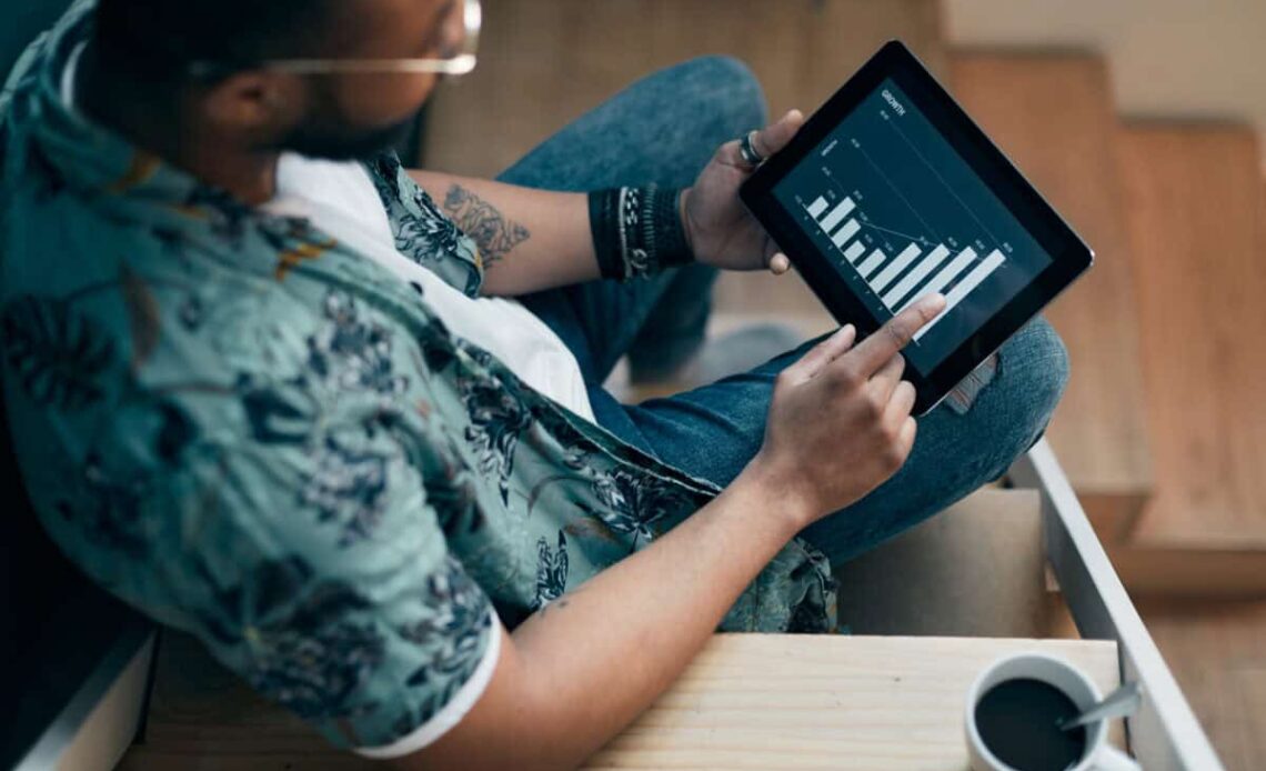 An investor uses a tablet