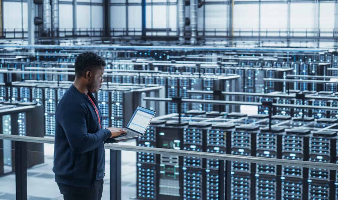 Data Center Engineer Using Laptop Computer crypto mining