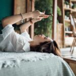 woman relaxes with phone