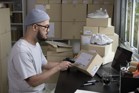 scanning a package shipping label for ecommerce delivery