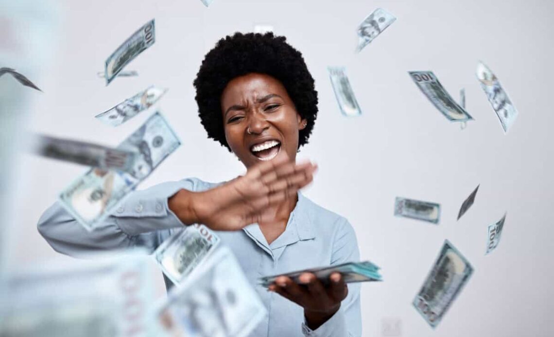 happy woman throws cash