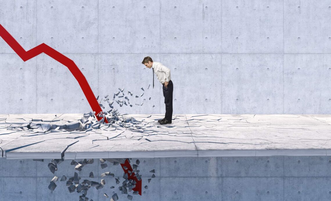 a person watches a downward arrow crash through the floor